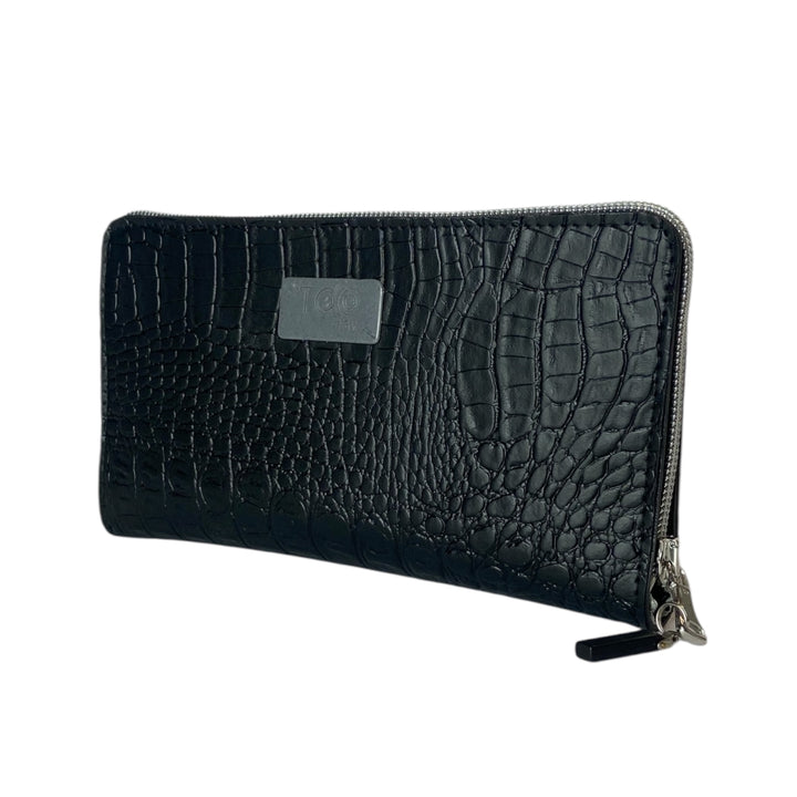 Portafoglio donna PVC e pelle vegan, con tasca interna con cerniera e scomparti per carte. Chiusura con zip, disponibile in due misure