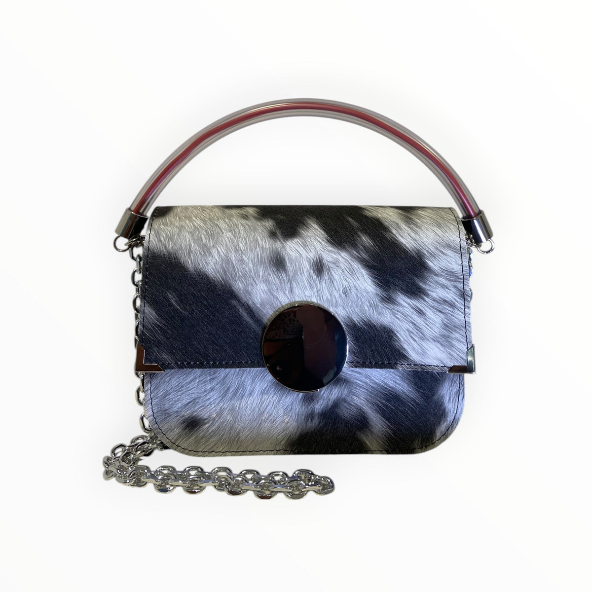 Borsa Chicca XL TOOitaly effetto muccato realistico con chiusura circolare a specchio e manico tubolare trasparente con anima rossa.
